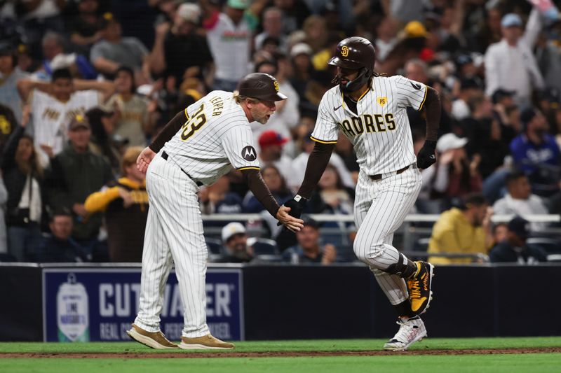 May 25, 2024; San Diego, California, USA; San Diego Padres right fielder Fernando Tatis Jr. (23) hits a solo home run in the eighth inning against the New York Yankees at Petco Park. Mandatory Credit: Chadd Cady-USA TODAY Sports