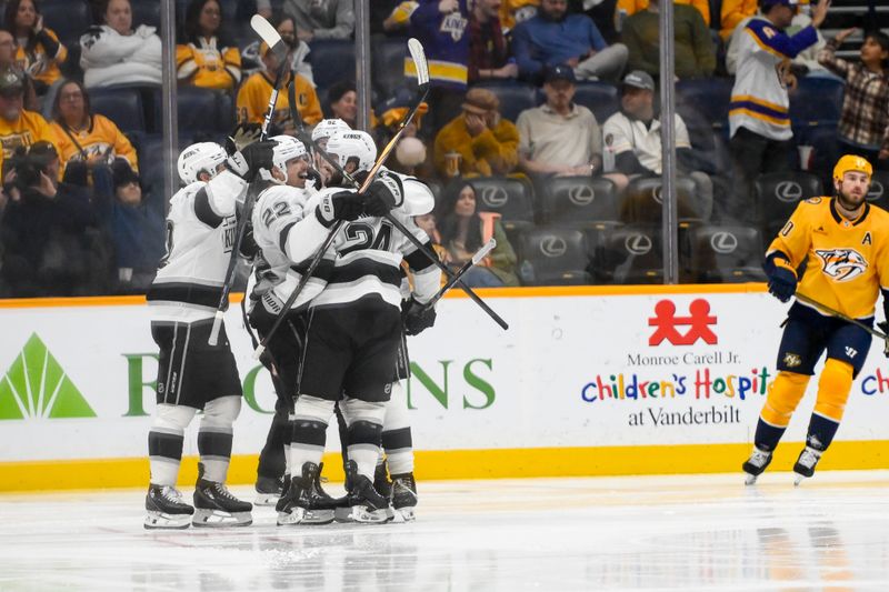 Nov 4, 2024; Nashville, Tennessee, USA;  Los Angeles Kings left wing Kevin Fiala (22) celebrates his goal with his teammates against the Nashville Predators during the third period at Bridgestone Arena. Mandatory Credit: Steve Roberts-Imagn Images