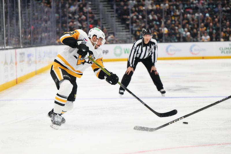 Jan 25, 2025; Seattle, Washington, USA; Pittsburgh Penguins left wing Matt Nieto (83) passes the puck against the Seattle Kraken during the second period at Climate Pledge Arena. Mandatory Credit: Steven Bisig-Imagn Images