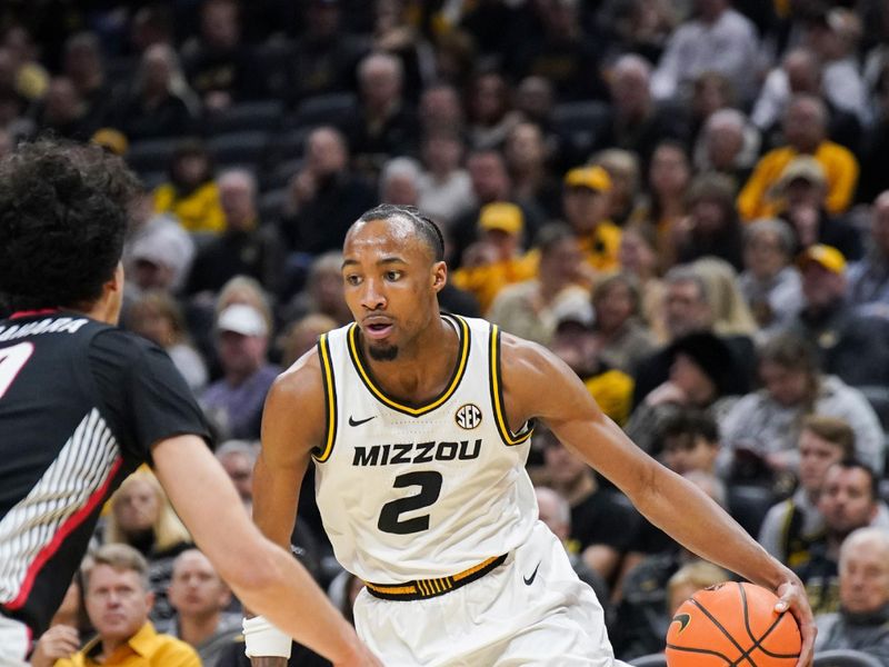 Jan 6, 2024; Columbia, Missouri, USA; Missouri Tigers guard Tamar Bates (2) dribbles the ball as Georgia Bulldogs guard RJ Sunahara (10) defends during the first half at Mizzou Arena. Mandatory Credit: Denny Medley-USA TODAY Sports