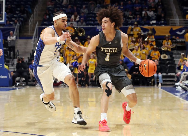 Feb 25, 2025; Pittsburgh, Pennsylvania, USA;  Georgia Tech Yellow Jackets guard Naithan George (1) dribbles against Pittsburgh Panthers guard Ishmael Leggett (5) during the first half at the Petersen Events Center. Mandatory Credit: Charles LeClaire-Imagn Images