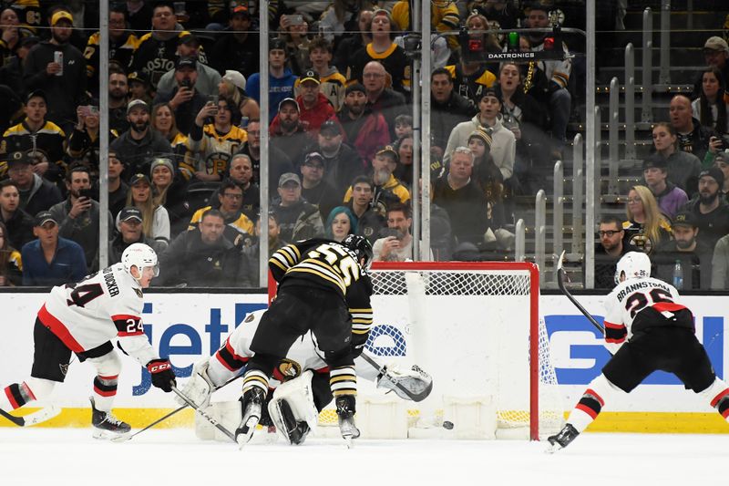 Mar 19, 2024; Boston, Massachusetts, USA;  Boston Bruins right wing Justin Brazeau (55) scores a goal past Ottawa Senators defenseman Thomas Chabot (72) while defenseman Jacob Bernard-Docker (24) and defenseman Erik Brannstrom (26) defend during the second period at TD Garden. Mandatory Credit: Bob DeChiara-USA TODAY Sports