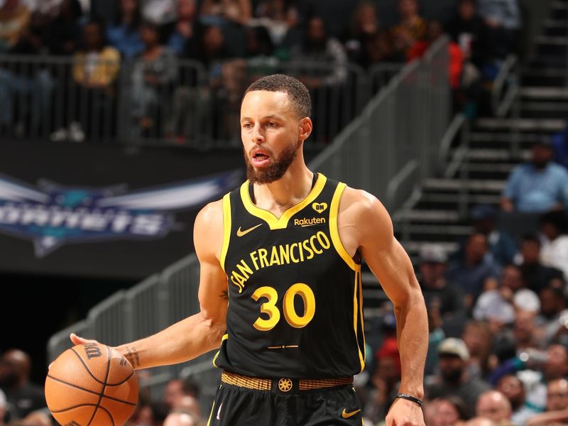 CHARLOTTE, NC - MARCH 29: Stephen Curry #30 of the Golden State Warriors handles the ball during the game against the Charlotte Hornets on March 29, 2024 at Spectrum Center in Charlotte, North Carolina. NOTE TO USER: User expressly acknowledges and agrees that, by downloading and or using this photograph, User is consenting to the terms and conditions of the Getty Images License Agreement. Mandatory Copyright Notice: Copyright 2024 NBAE (Photo by Kent Smith/NBAE via Getty Images)