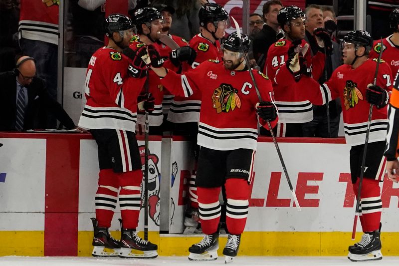 Nov 6, 2024; Chicago, Illinois, USA;Chicago Blackhawks left wing Nick Foligno (17) celebrates his goal against the Detroit Red Wings during the second period at United Center. Mandatory Credit: David Banks-Imagn Images