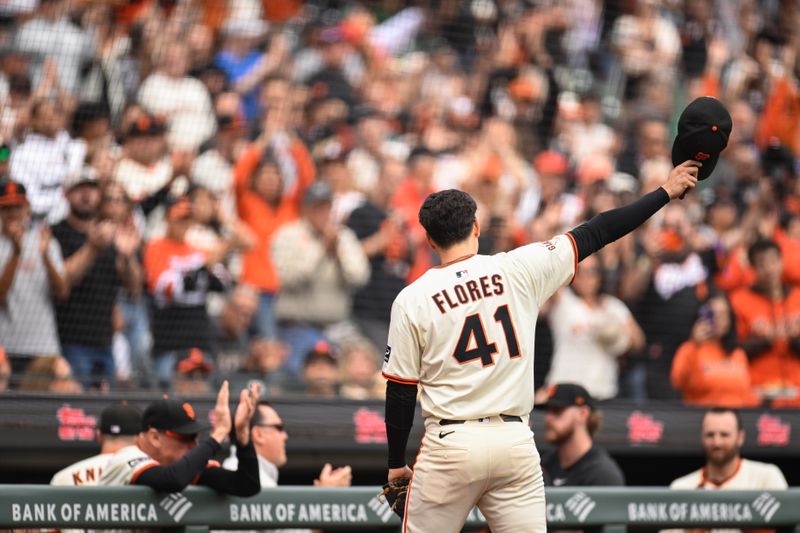 Sep 28, 2025; San Francisco, California, USA;  San Francisco Giants first baseman Wilmer Flores (41) waves to the crowd after being taken out of the game against the Colorado Rockies in the third inning at Oracle Park. Mandatory Credit: Eakin Howard-Imagn Images