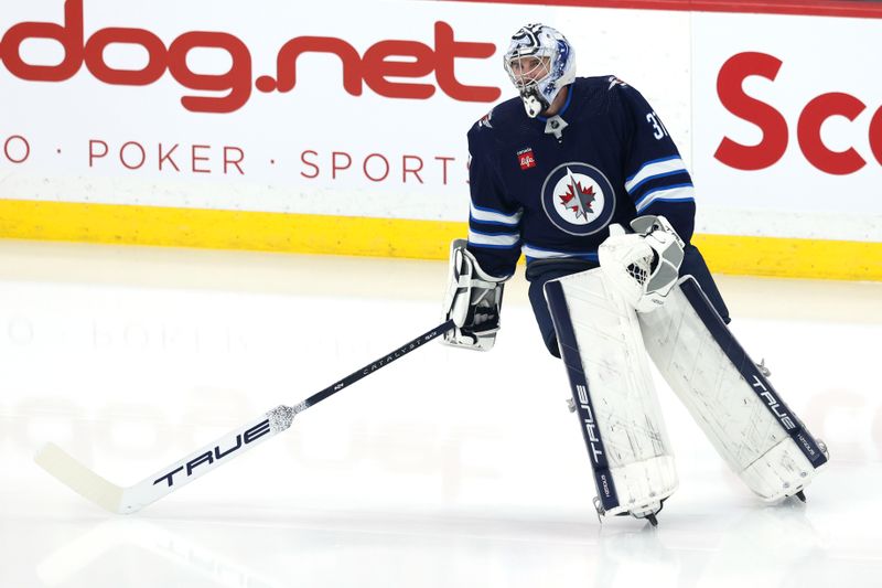 Apr 30, 2024; Winnipeg, Manitoba, CAN;Winnipeg Jets goaltender Connor Hellebuyck (37) warms up before the game against the Colorado Avalanche in game five of the first round of the 2024 Stanley Cup Playoffs at Canada Life Centre. Mandatory Credit: James Carey Lauder-USA TODAY Sports