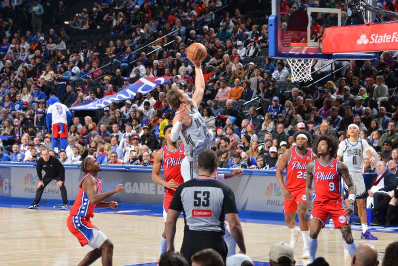 PHILADELPHIA, PA - DECEMBER 6: Moritz Wagner #21 of the Orlando Magic rebounds the ball during the game against the Philadelphia 76ers on December 6, 2024 at the Wells Fargo Center in Philadelphia, Pennsylvania NOTE TO USER: User expressly acknowledges and agrees that, by downloading and/or using this Photograph, user is consenting to the terms and conditions of the Getty Images License Agreement. Mandatory Copyright Notice: Copyright 2024 NBAE (Photo by Jesse D. Garrabrant/NBAE via Getty Images)