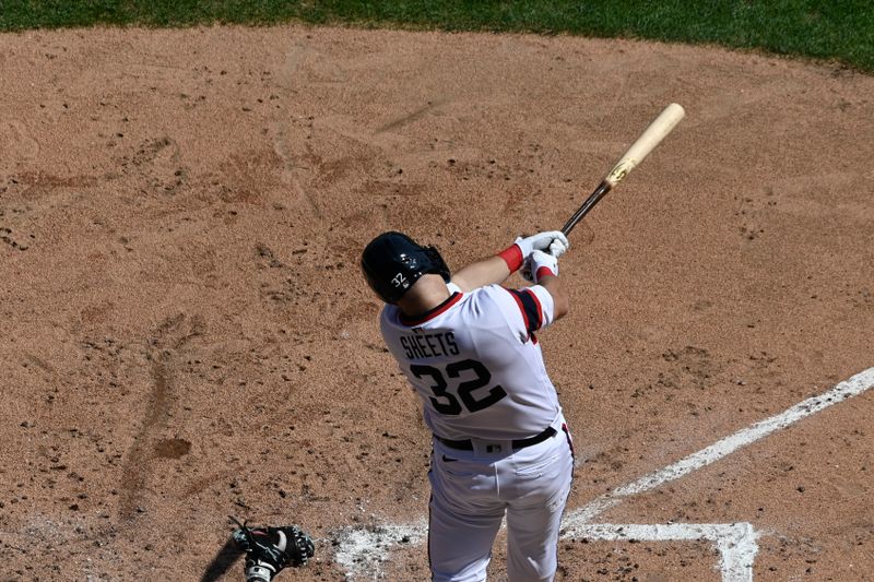 Aug 27, 2023; Chicago, Illinois, USA;  Chicago White Sox right fielder Gavin Sheets (32) hits an RBI single against the Chicago White Sox during the sixth inning at Guaranteed Rate Field. Mandatory Credit: Matt Marton-USA TODAY Sports