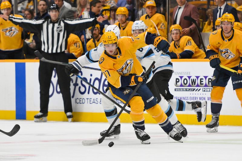 Oct 11, 2025; Nashville, Tennessee, USA;  Nashville Predators right wing Luke Evangelista (77) skates with the puck against the Utah Mammoth during the second period at Bridgestone Arena. Mandatory Credit: Steve Roberts-Imagn Images