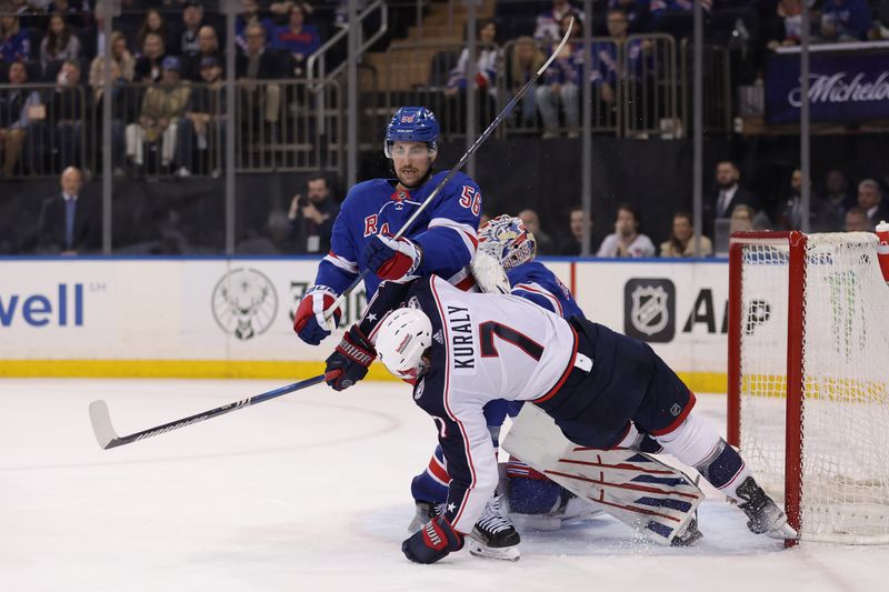 Feb 28, 2024; New York, New York, USA; New York Rangers defenseman Erik Gustafsson (56) knocks Columbus Blue Jackets center Sean Kuraly (7) to the ice in front of Rangers goaltender Igor Shesterkin (31) during the third period at Madison Square Garden. Mandatory Credit: Brad Penner-USA TODAY Sports