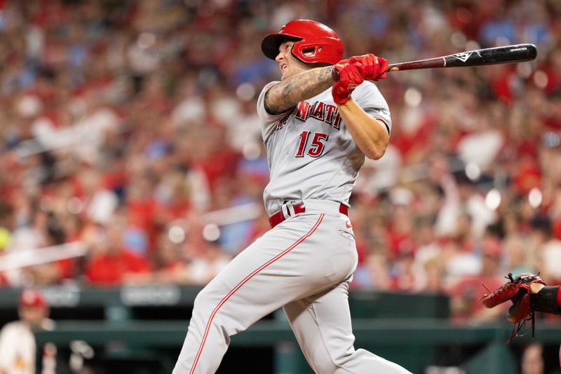 Sep 30, 2023; St. Louis, Missouri, USA; Cincinnati Reds third baseman Nick Senzel (15) hits a homerun in the fifth inning against the St. Louis Cardinals at Busch Stadium. Mandatory Credit: Zach Dalin-USA TODAY Sports