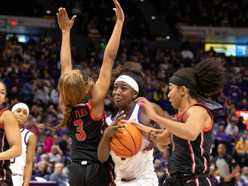 Feb 2, 2023; Baton Rouge, Louisiana, USA;  LSU Lady Tigers guard Flau'jae Johnson (4) drives to the basket against Georgia Lady Bulldogs guard Diamond Battles (3) during the first half at Pete Maravich Assembly Center. Mandatory Credit: Stephen Lew-USA TODAY Sports