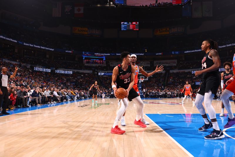 OKLAHOMA CITY, OK - JANUARY 23: Toumani Camara #33 of the Portland Trail Blazers handles the ball during the game against the Oklahoma City Thunder on January 23, 2024 at Paycom Arena in Oklahoma City, Oklahoma. NOTE TO USER: User expressly acknowledges and agrees that, by downloading and or using this photograph, User is consenting to the terms and conditions of the Getty Images License Agreement. Mandatory Copyright Notice: Copyright 2024 NBAE (Photo by Zach Beeker/NBAE via Getty Images)