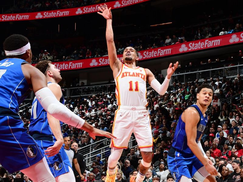 ATLANTA, GA - JANUARY 26: Trae Young #11 of the Atlanta Hawks shoots the ball during the game against the Dallas Mavericks on January 26, 2024 at State Farm Arena in Atlanta, Georgia.  NOTE TO USER: User expressly acknowledges and agrees that, by downloading and/or using this Photograph, user is consenting to the terms and conditions of the Getty Images License Agreement. Mandatory Copyright Notice: Copyright 2024 NBAE (Photo by Scott Cunningham/NBAE via Getty Images)