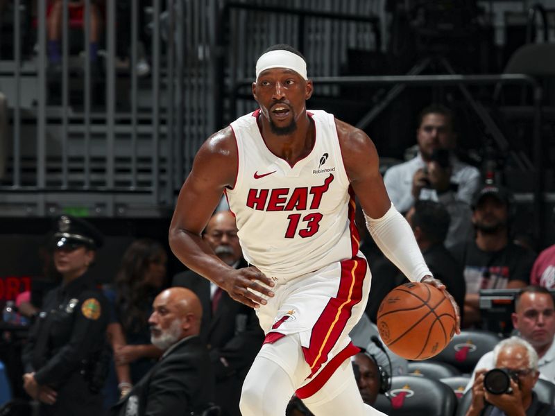 MIAMI, FL - OCTOBER 15: Bam Adebayo #13 of the Miami Heat drives to the basket during the game on October 15, 2024 at Kaseya Center in Miami, Florida. NOTE TO USER: User expressly acknowledges and agrees that, by downloading and or using this Photograph, user is consenting to the terms and conditions of the Getty Images License Agreement. Mandatory Copyright Notice: Copyright 2024 NBAE (Photo by Issac Baldizon/NBAE via Getty Images)