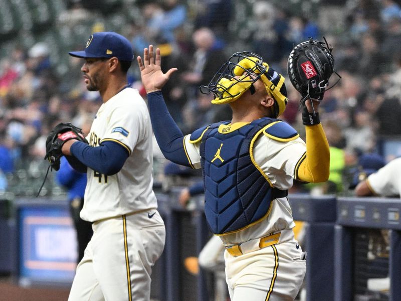 Apr 3, 2024; Milwaukee, Wisconsin, USA; Milwaukee Brewers starting pitcher Joe Ross (41) and Milwaukee Brewers catcher William Contreras (24) walk onto the field at the start of the first inning against the Minnesota Twins at American Family Field. Mandatory Credit: Michael McLoone-USA TODAY Sports