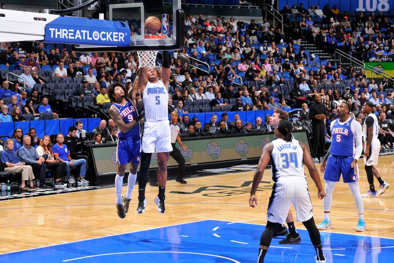 ORLANDO, FL - OCTOBER 18: Paolo Banchero #5 of the Orlando Magic dunks the ball during the game against the Philadelphia 76ers during a NBA preseason game on October 18, 2024 at Kia Center in Orlando, Florida. NOTE TO USER: User expressly acknowledges and agrees that, by downloading and or using this photograph, User is consenting to the terms and conditions of the Getty Images License Agreement. Mandatory Copyright Notice: Copyright 2024 NBAE (Photo by Fernando Medina/NBAE via Getty Images)