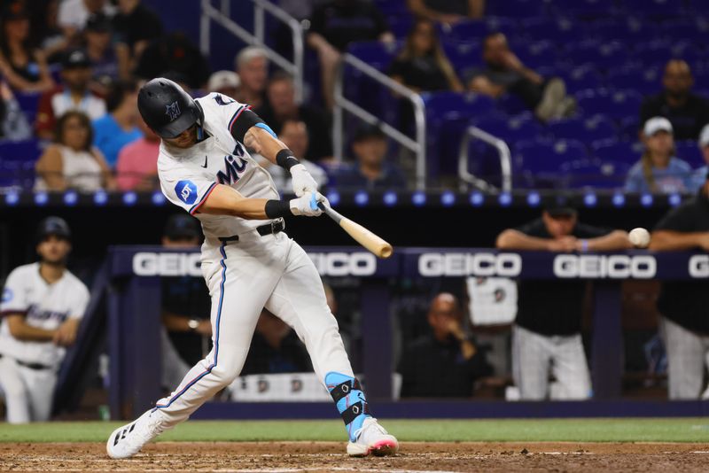 Sep 5, 2024; Miami, Florida, USA; Miami Marlins designated hitter Connor Norby (24) hits a single against the Philadelphia Phillies during the third inning at loanDepot Park. Mandatory Credit: Sam Navarro-Imagn Images