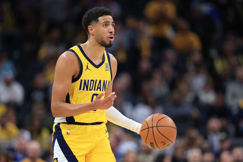 INDIANAPOLIS, INDIANA - OCTOBER 27: Tyrese Haliburton #0 of the Indiana Pacers brings the ball up the court in overtime against the Philadelphia 76ers at Gainbridge Fieldhouse on October 27, 2024 in Indianapolis, Indiana. NOTE TO USER: User expressly acknowledges and agrees that, by downloading and or using this photograph, User is consenting to the terms and conditions of the Getty Images License Agreement. (Photo by Justin Casterline/Getty Images)