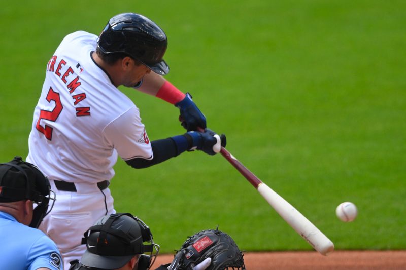 Jul 6, 2024; Cleveland, Ohio, USA; Cleveland Guardians center fielder Tyler Freeman (2) hits an RBI single in the first inning against the San Francisco Giants at Progressive Field. Mandatory Credit: David Richard-USA TODAY Sports