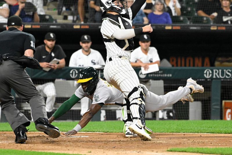 Sep 13, 2024; Chicago, Illinois, USA;  Oakland Athletics outfielder Daz Cameron (28) scores past Chicago White Sox catcher Korey Lee (26) during the fourth inning at Guaranteed Rate Field. Mandatory Credit: Matt Marton-Imagn Images