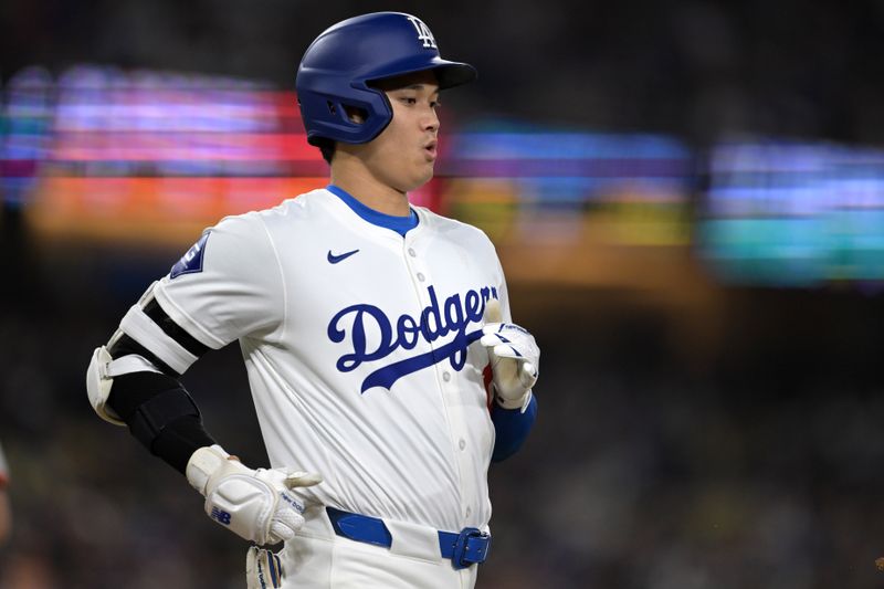 Apr 2, 2024; Los Angeles, California, USA;  Los Angeles Dodgers designated hitter Shohei Ohtani (17) runs to first on a ground out in the sixth against the San Francisco Giants at Dodger Stadium. Mandatory Credit: Jayne Kamin-Oncea-USA TODAY Sports