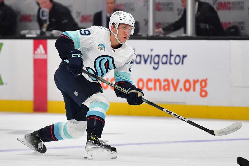 Apr 5, 2024; Anaheim, California, USA; Seattle Kraken defenseman Ryker Evans (39) shoots on goal against the Anaheim Ducks during the first period at Honda Center. Mandatory Credit: Gary A. Vasquez-USA TODAY Sports