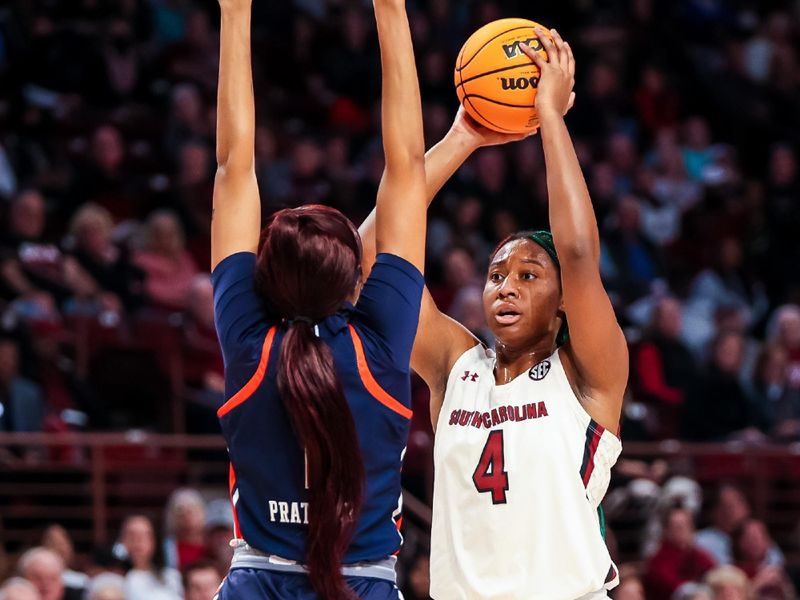 Jan 5, 2023; Columbia, South Carolina, USA; South Carolina Gamecocks forward Aliyah Boston (4) looks to pass around Auburn Tigers forward Mya Pratcher (1) in the first half at Colonial Life Arena. Mandatory Credit: Jeff Blake-USA TODAY Sports