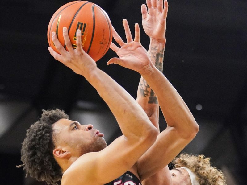 Jan 6, 2024; Columbia, Missouri, USA; Georgia Bulldogs guard Jabri Abdur-Rahim (1) shoots as Missouri Tigers forward Noah Carter (35) defends during the second half at Mizzou Arena. Mandatory Credit: Denny Medley-USA TODAY Sports