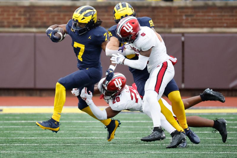 Oct 14, 2023; Ann Arbor, Michigan, USA; Michigan Wolverines running back Donovan Edwards (7) rushes in the first half against the Indiana Hoosiers at Michigan Stadium. Mandatory Credit: Rick Osentoski-USA TODAY Sports