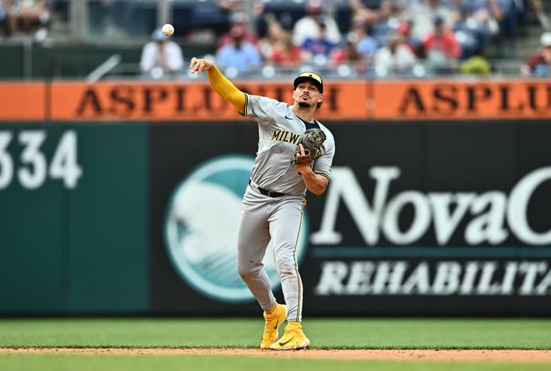 Jun 5, 2024; Philadelphia, Pennsylvania, USA; Milwaukee Brewers infielder Willy Adames (27) throws to first base  against the Philadelphia Phillies in the sixth inning at Citizens Bank Park. Mandatory Credit: Kyle Ross-USA TODAY Sports