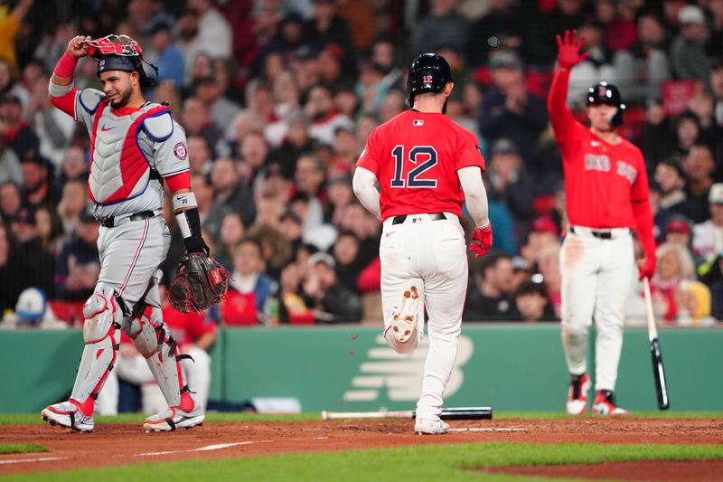 May 10, 2024; Boston, Massachusetts, USA; Boston Red Sox catcher Connor Wong (12) scores a run on Boston Red Sox first baseman Garrett Cooper (not pictured) RBI double against the Washington Nationals during the fourth inning at Fenway Park. Mandatory Credit: Gregory Fisher-USA TODAY Sports