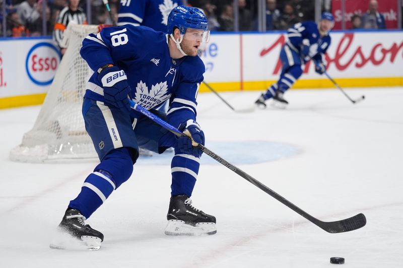 Mar 2, 2026; Toronto, Ontario, CAN; Toronto Maple Leafs forward Steven Lorentz (18) carries the puck against the Philadelphia Flyers during the second period at Scotiabank Arena. Mandatory Credit: John E. Sokolowski-Imagn Images