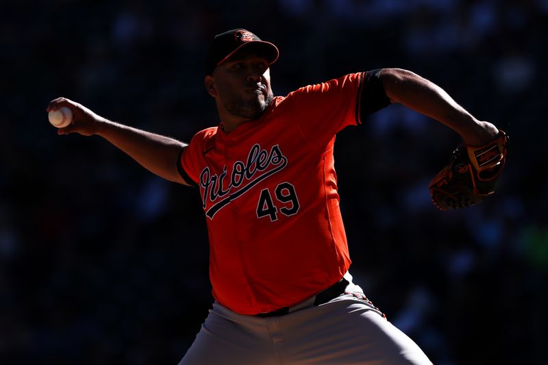 Sep 29, 2024; Minneapolis, Minnesota, USA; Baltimore Orioles starting pitcher Albert Suarez (49) delivers a pitch against the Minnesota Twins during the first inning at Target Field. Mandatory Credit: Matt Krohn-Imagn Images