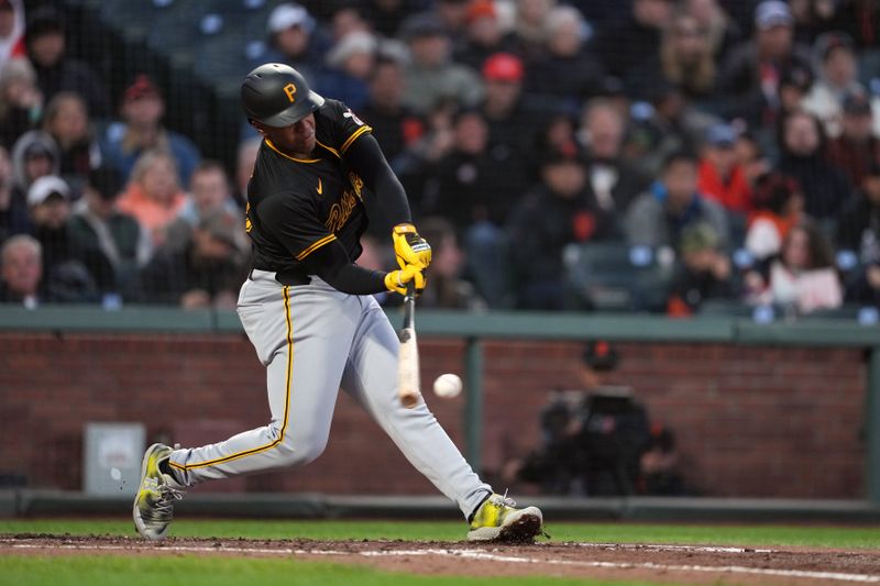 Apr 26, 2024; San Francisco, California, USA; Pittsburgh Pirates third baseman Ke'Bryan Hayes (13) hits a single against the San Francisco Giants during the third inning at Oracle Park. Mandatory Credit: Darren Yamashita-USA TODAY Sports