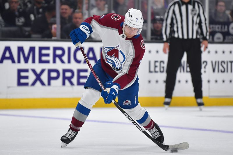 Dec 3, 2023; Los Angeles, California, USA; Colorado Avalanche defenseman Devon Toews (7) shoots on goal against the Los Angeles Kings during the first period at Crypto.com Arena. Mandatory Credit: Gary A. Vasquez-USA TODAY Sports