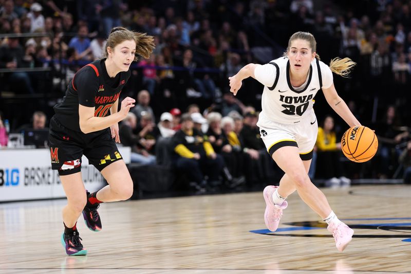 Mar 4, 2023; Minneapolis, MINN, USA; Iowa Hawkeyes guard Kate Martin (20) dribbles while Maryland Terrapins guard Abby Meyers (10) defends during the first half at Target Center. Mandatory Credit: Matt Krohn-USA TODAY Sports