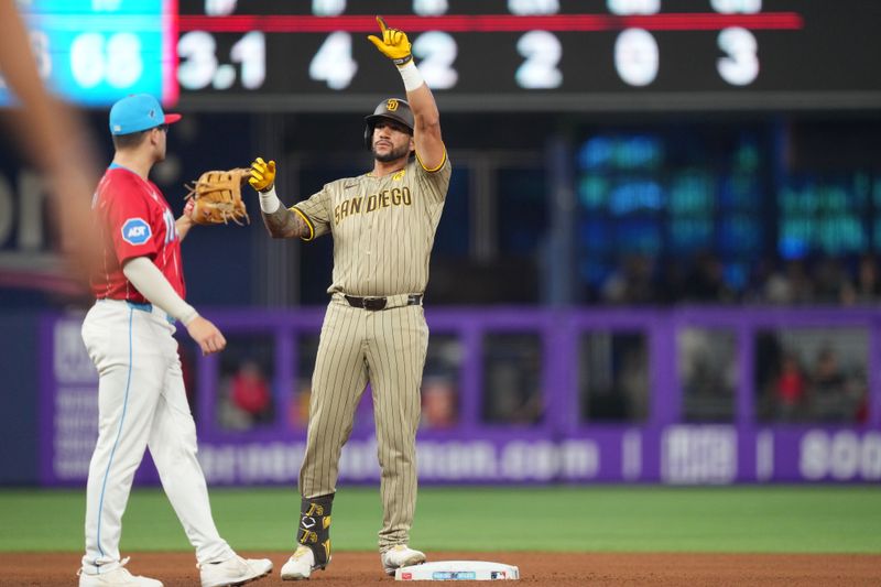 Aug 10, 2024; Miami, Florida, USA;  San Diego Padres right fielder David Peralta (24) celebrates hitting a double in the fourth inning against the Miami Marlins at loanDepot Park. Mandatory Credit: Jim Rassol-USA TODAY Sports