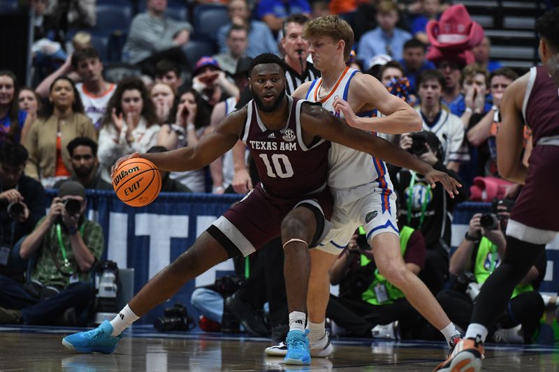 Mar 16, 2024; Nashville, TN, USA; Texas A&M Aggies forward Wildens Leveque (10) works against Florida Gators forward Thomas Haugh (10) during the first half at Bridgestone Arena. Mandatory Credit: Christopher Hanewinckel-USA TODAY Sports