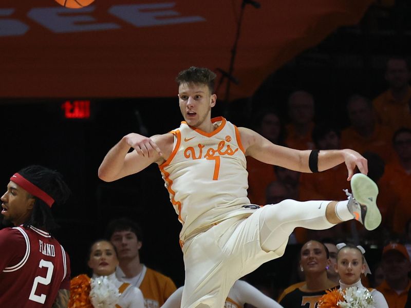 Jan 4, 2025; Knoxville, Tennessee, USA; Tennessee Volunteers forward Igor Milicic Jr. (7) tries to keep a ball inbounds against the Arkansas Razorbacks during the second half at Thompson-Boling Arena at Food City Center. Mandatory Credit: Randy Sartin-Imagn Images