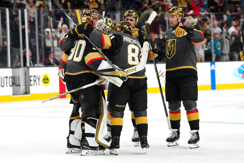 Dec 10, 2023; Las Vegas, Nevada, USA; Vegas Golden Knights goaltender Jiri Patera (30) celebrates with team mates after the Golden Knights defeated the San Jose Sharks 5-4 in a shoot out at T-Mobile Arena. Mandatory Credit: Stephen R. Sylvanie-USA TODAY Sports