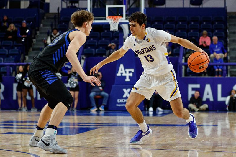 Jan 13, 2024; Colorado Springs, Colorado, USA; San Jose State Spartans guard Alvaro Cardenas (13) drives to the net against Air Force Falcons guard Kellan Boylan (23) in the second half at Clune Arena. Mandatory Credit: Isaiah J. Downing-USA TODAY Sports