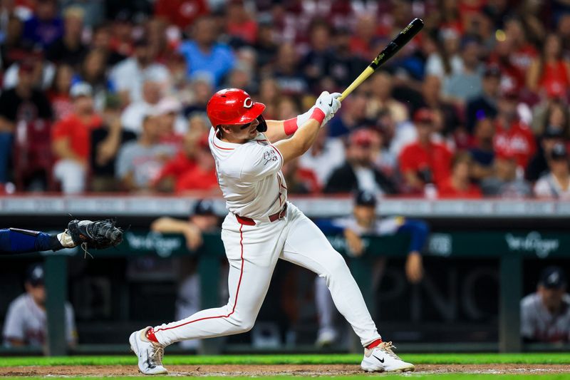 Sep 17, 2024; Cincinnati, Ohio, USA; Cincinnati Reds outfielder Spencer Steer (7) hits a two-run home run in the seventh inning against the Atlanta Braves at Great American Ball Park. Mandatory Credit: Katie Stratman-Imagn Images