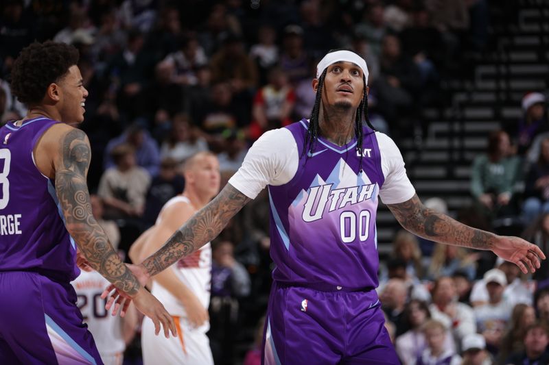 SALT LAKE CITY, UT - DECEMBER 13:  Jordan Clarkson #00 of the Utah Jazz high five during the game against the Phoenix Suns during a regular season game on December 13, 2024 at Delta Center in Salt Lake City, Utah. NOTE TO USER: User expressly acknowledges and agrees that, by downloading and or using this Photograph, User is consenting to the terms and conditions of the Getty Images License Agreement. Mandatory Copyright Notice: Copyright 2024 NBAE (Photo by Melissa Majchrzak/NBAE via Getty Images)