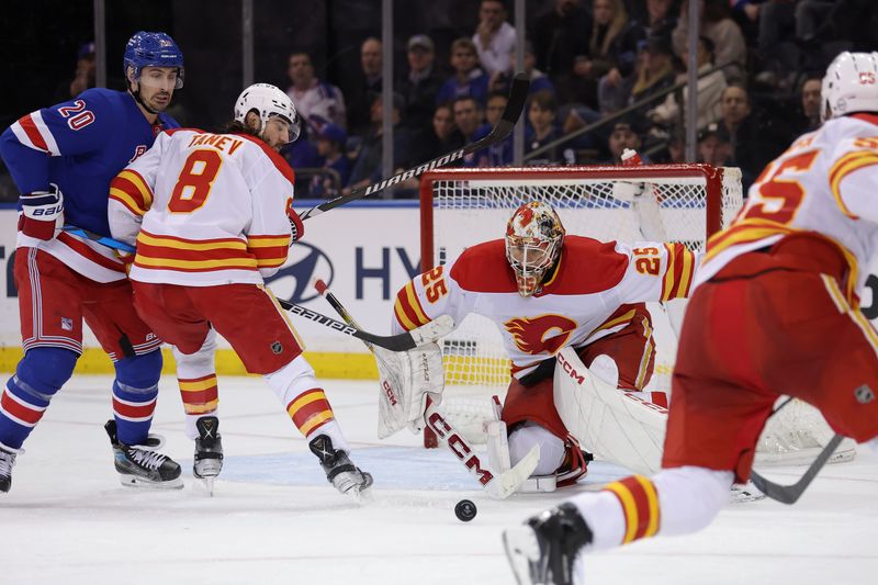 Feb 12, 2024; New York, New York, USA; Calgary Flames goaltender Jacob Markstrom (25) makes a save against the New York Rangers during the third period at Madison Square Garden. Mandatory Credit: Brad Penner-USA TODAY Sports