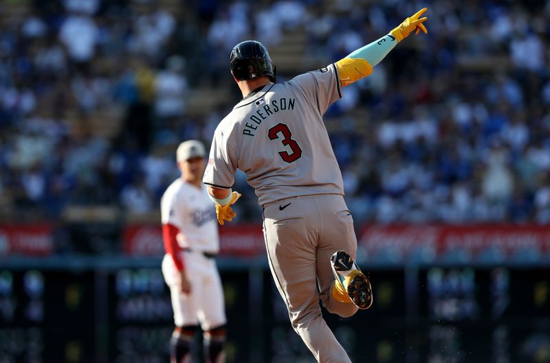 Jul 4, 2024; Los Angeles, California, USA; Arizona Diamondbacks designated hitter Joc Pederson (3) celebrates after a home rung during the first inning against the Los Angeles Dodgers at Dodger Stadium. Mandatory Credit: Jason Parkhurst-USA TODAY Sports