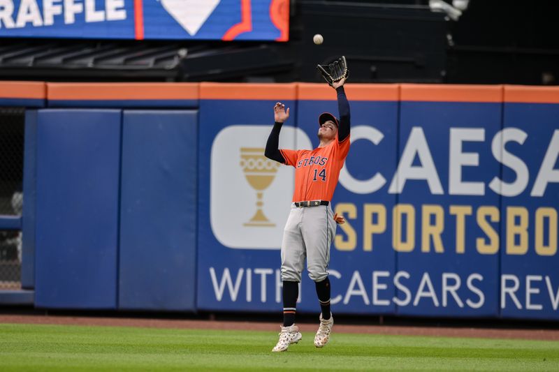 Jun 29, 2024; New York City, New York, USA; Houston Astros outfielder Mauricio Dubón (14) catches a fly ball for an out against the New York Mets during the fifth inning at Citi Field. Mandatory Credit: John Jones-USA TODAY Sports