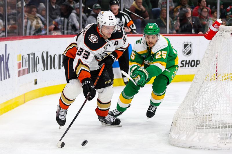 Jan 27, 2024; Saint Paul, Minnesota, USA; Anaheim Ducks right wing Jakob Silfverberg (33) skates with the puck as Minnesota Wild defenseman Jonas Brodin (25) defends  during the third period at Xcel Energy Center. Mandatory Credit: Matt Krohn-USA TODAY Sports