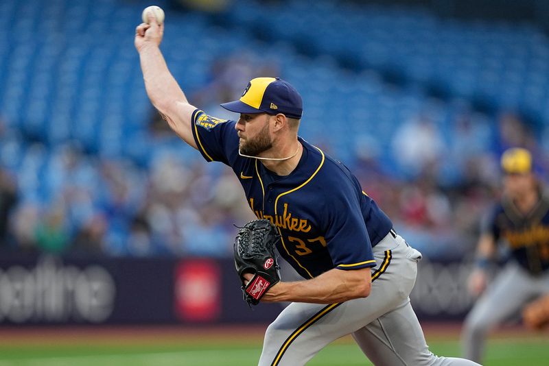 May 30, 2023; Toronto, Ontario, CAN; Milwaukee Brewers starting pitcher Adrian Houser (37) pitches to the Toronto Blue Jays during the first inning at Rogers Centre. Mandatory Credit: John E. Sokolowski-USA TODAY Sports