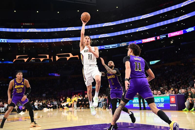 LOS ANGELES, CA - FEBRUARY 9:  Dyson Daniels #11 of the New Orleans Pelicans drives to the basket during the game against the Los Angeles Lakers on February 9, 2024 at Crypto.Com Arena in Los Angeles, California. NOTE TO USER: User expressly acknowledges and agrees that, by downloading and/or using this Photograph, user is consenting to the terms and conditions of the Getty Images License Agreement. Mandatory Copyright Notice: Copyright 2024 NBAE (Photo by Adam Pantozzi/NBAE via Getty Images)